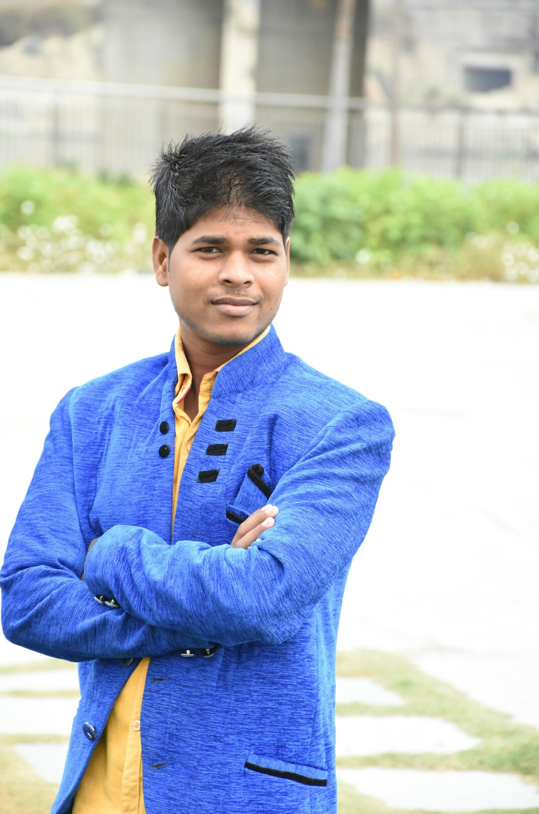 Portrait of a man in a suit with a confident smile