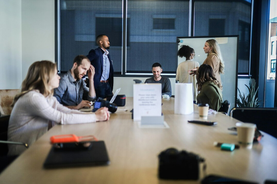 corporate team discussing software